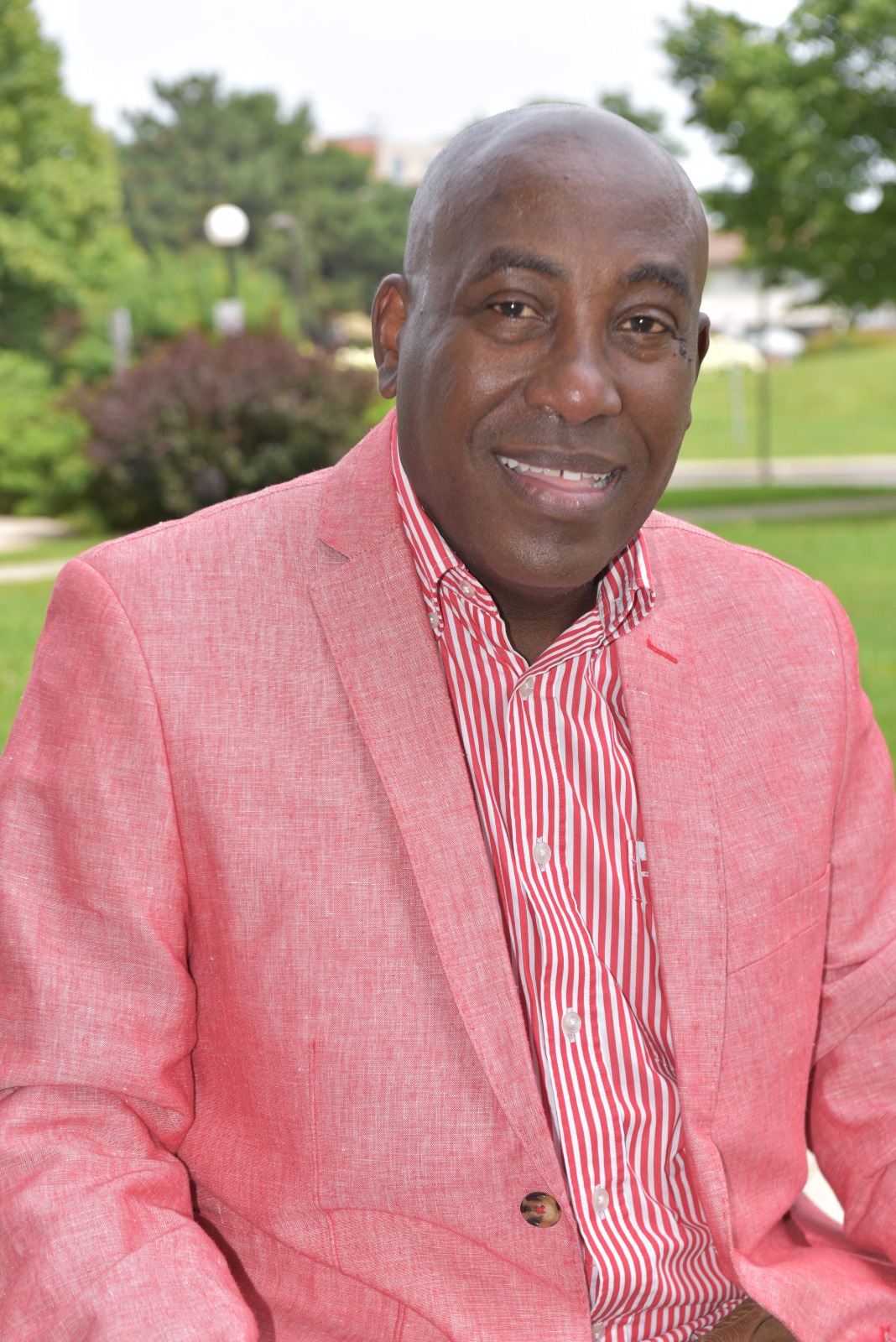 Jules Ruhinda smiling outdoors
